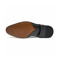 Prestige elevated dress shoe outsole with brown leather tread and black heel cap showing refined construction for a discreet height boost and polished mens style
