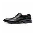 Prestige black leather men's dress shoe with brogue detailing and discreet height boost for polished professional style