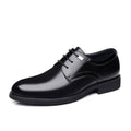 Sleek black Regent men's dress shoe with a polished finish, featuring a hidden lift for a discreet height boost.
