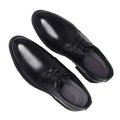 Pair of sleek black Regent men's dress shoes with a polished finish, featuring discreet internal lift for a subtle height boost and comfortable insoles for everyday wear.