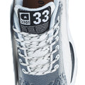 Retro33 men's sneaker close up with a white and gray mesh upper white laces padded tongue and bold number 33 detail for a sporty look