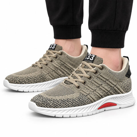 Rise33 beige knit men's sneakers with beige laces, cushioned white soles, red accents and a discreet height boost shown on foot