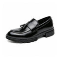Sterling black mens dress loafer with tassel detailing and discreet height boost an elegant elevator shoe for formal style