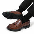 Sterling brown leather dress loafers with tassel detailing and a discreet height boost for polished men’s dress style