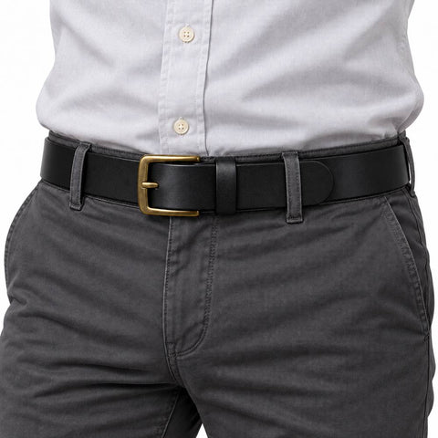 The Classic Belt black belt with gold tone buckle styled with gray trousers and a white button down shirt for a polished mens outfit