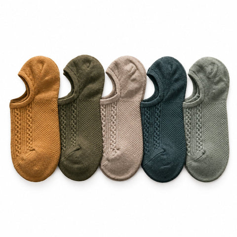 The Comfort Sock shown as five low cut no show socks in assorted neutral colors with textured knit patterns for comfortable everyday wear