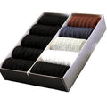 A gift box containing pairs of The Presidential Dress Sock in black, gray, white, navy, and brown.