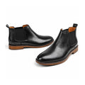 Wellington black leather Chelsea elevator boots with elastic side panels, pull tabs and a discreet height boost