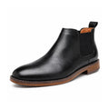 Wellington black leather Chelsea boot with elastic side panels, pull tab, stacked sole and a discreet height boost