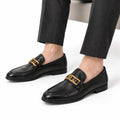 Whitmore black leather loafers with a gold-tone metal bit and polished finish for a discreet height boost